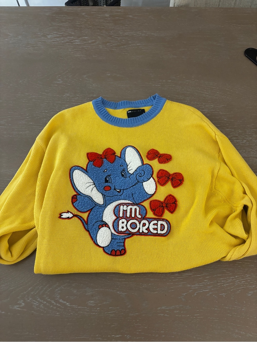 ASOS Yellow Crewneck Sweater with Blue Elephant Graphic and Red Bows